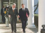 Vice President talking with President Clinton as the two pass through the Colonnade at the White House.