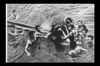 Unidentified man being pulled out of a lake in North Vietnam